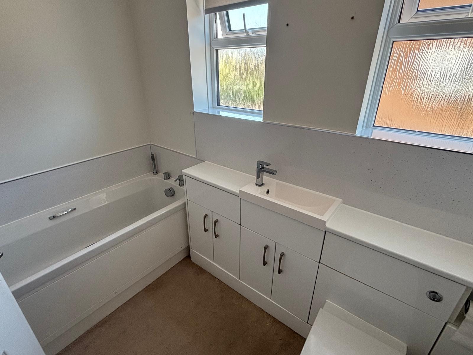 Bathroom bath reseal — clean white finish