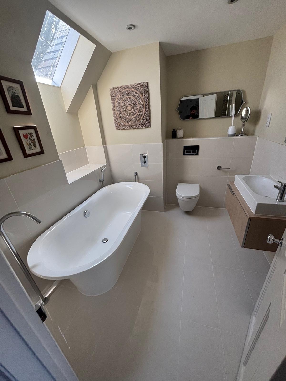 Bathroom reseal — spacious bathroom with freestanding bath and separate shower