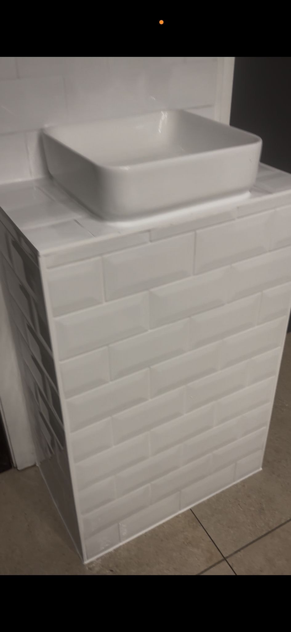 Commercial basin and tiled vanity unit — silicone sealed