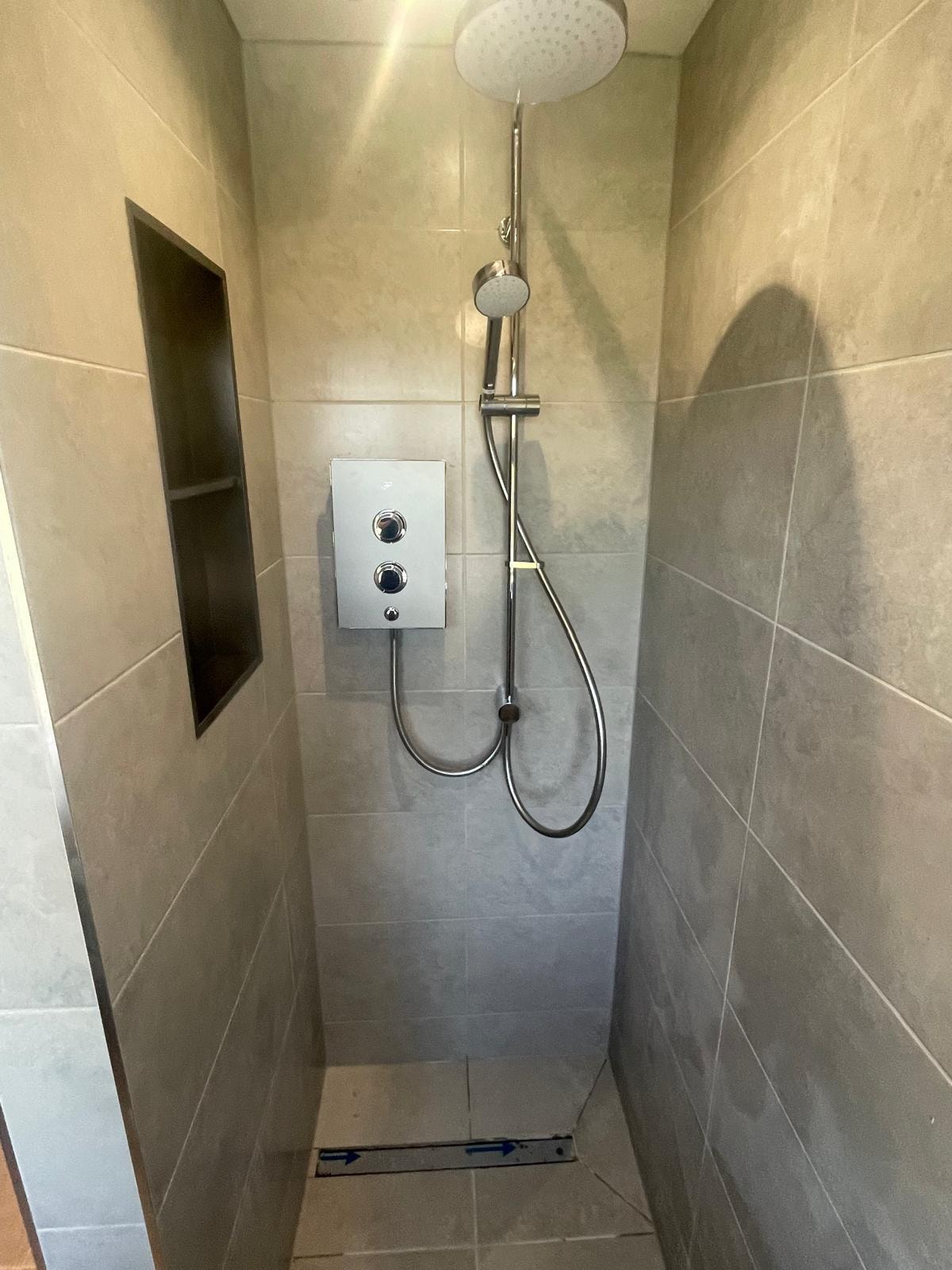 James sealing a shower enclosure